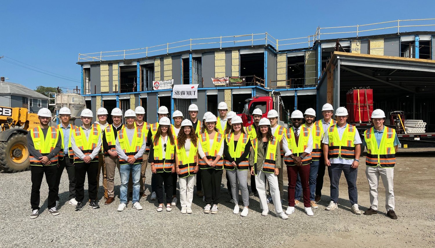 RWU students tour a Shawmut construction site, gaining firsthand insights into industry operations and business challenges.