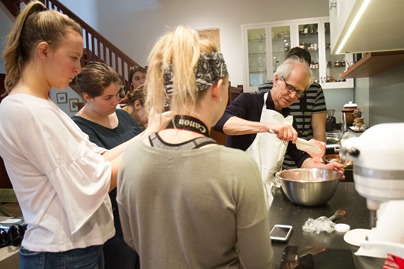 Schuhmacher shows students how the macaroon cookie should look when it is ready.