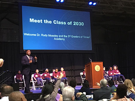 Executive Director Rudolph A. Moseley Jr. leads the third-grade class from a Providence STEM school in sharing their hopes of what they dream to become as the future Class of 2030.