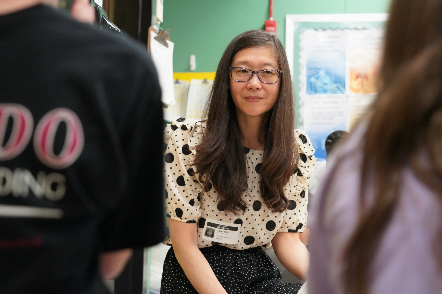 Li-Ling Yang checks in with fourth graders during a KidWind lesson at Hugh Cole Elementary School.