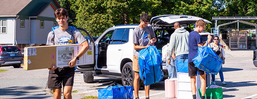 Students moving in their belongings