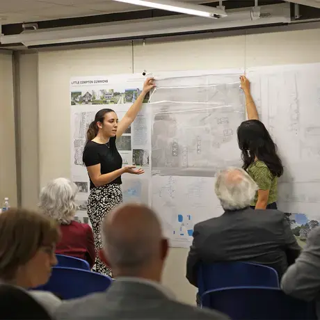 Two students presenting their final project