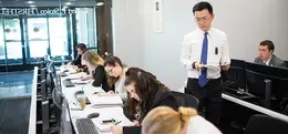 professor teaching to students on laptop