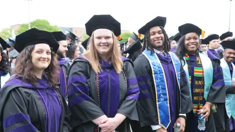 Soon to be graduates take their seats during the Commencement ceremony.