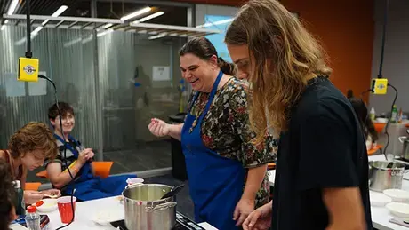 Jennifer Pearce, Associate Professor of Physics, with three students at the Food Science Camp
