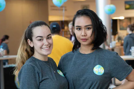 Two students pose.