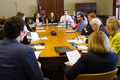 Students present advocacy brief to state legislators.