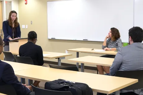 Students preparing for case in classroom.