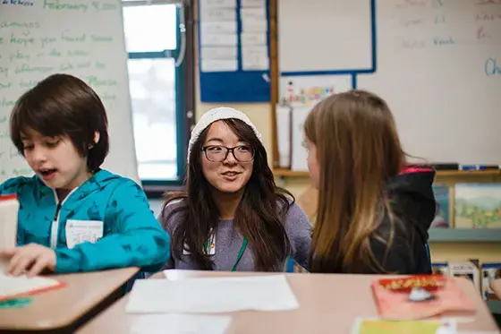Student teacher talking to student.