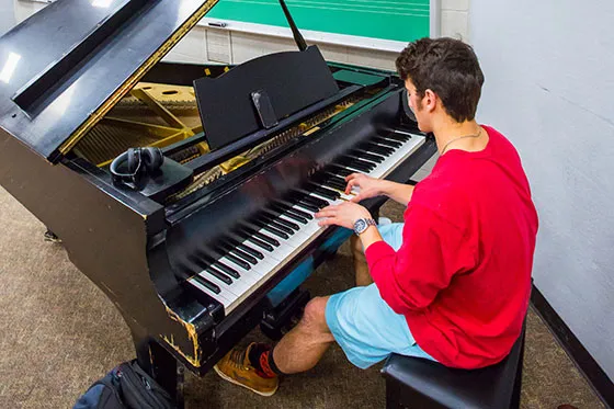Student playing piano.