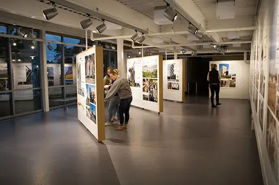 Students looking at work in a gallery