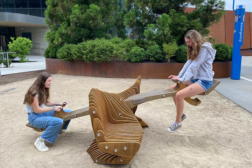 Summer Academy students on a public seesaw