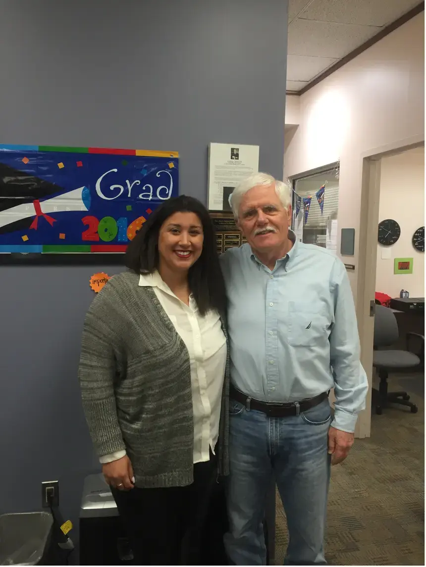 From left: 2016 Henderson Outstanding Tutor in Math, Kristina Biyad. She is congratulated by Richard Fullerton, Coordinator of the Math Center. 