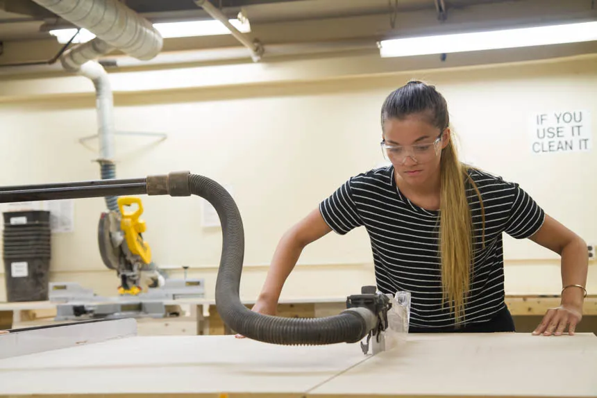 Gabby P. focused on her work with saw