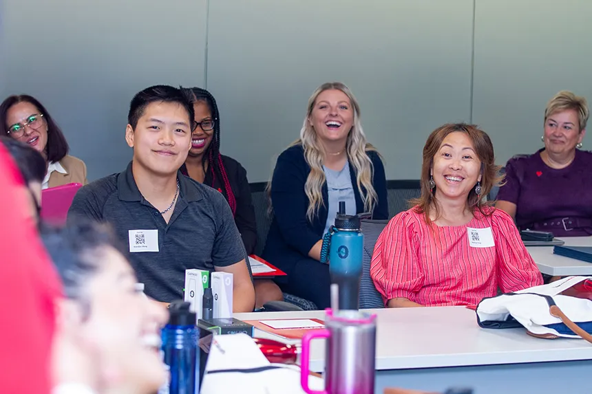 People sitting in a workshop at CVS headquarters building