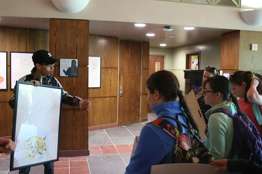 Student discusses illustration of leopard.